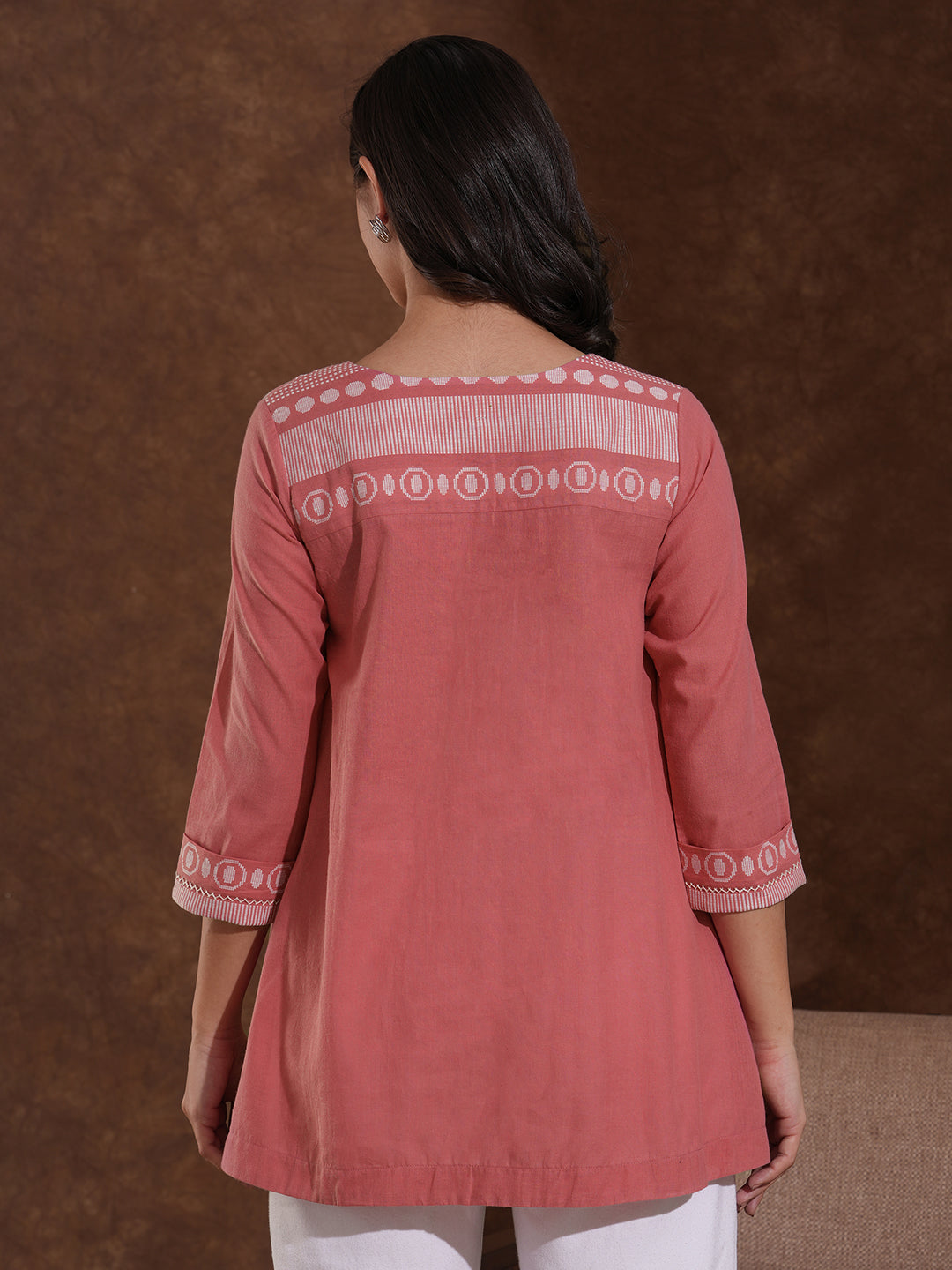 Woven cotton dobby tunic in light pink shade with hand embroidery.