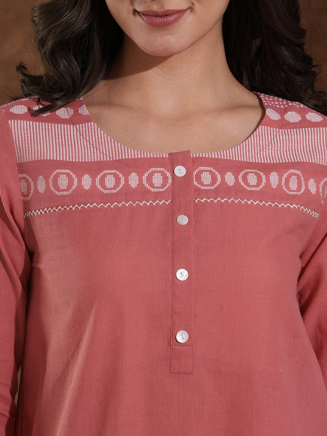 Woven cotton dobby tunic in light pink shade with hand embroidery.