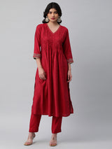 INAARA - Flared Pleated silk blend kurta with zari embroidery and sequin work.