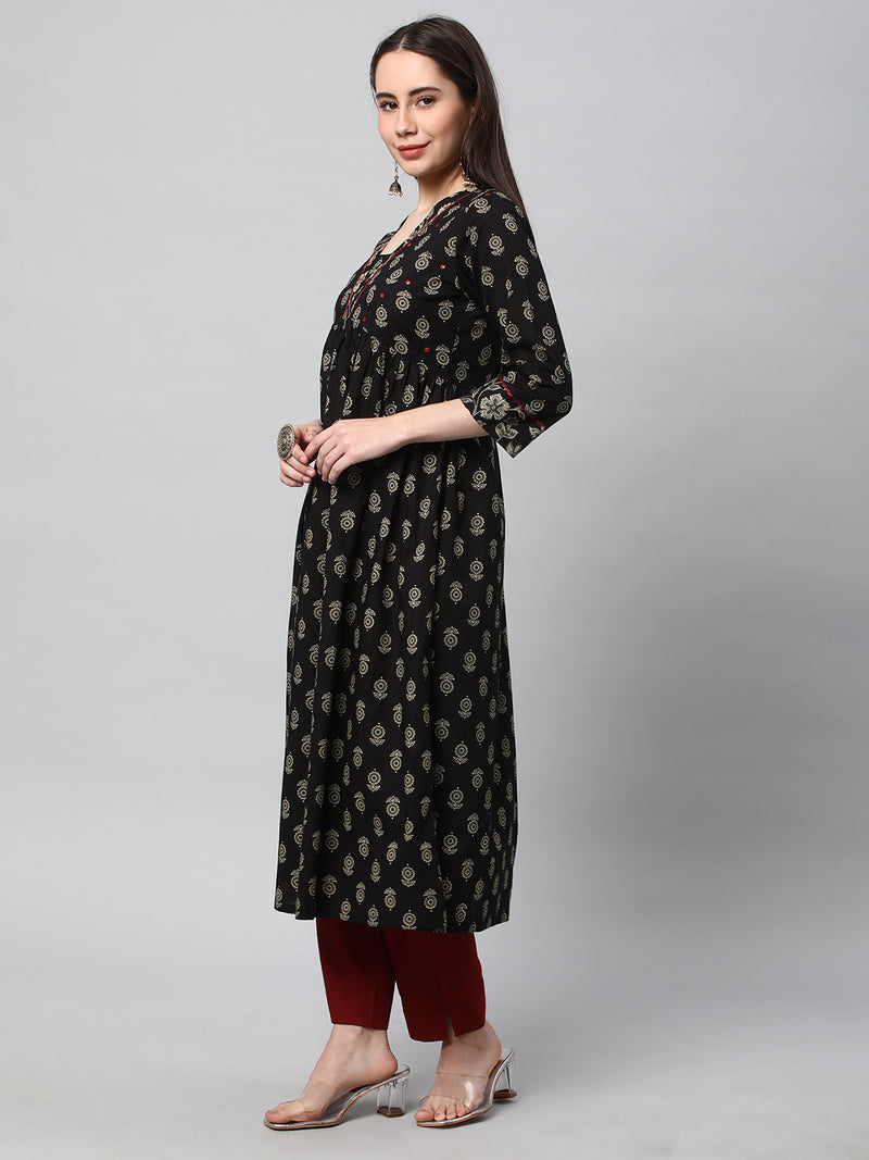 Printed cotton kurta with gathering and hand embroidery.