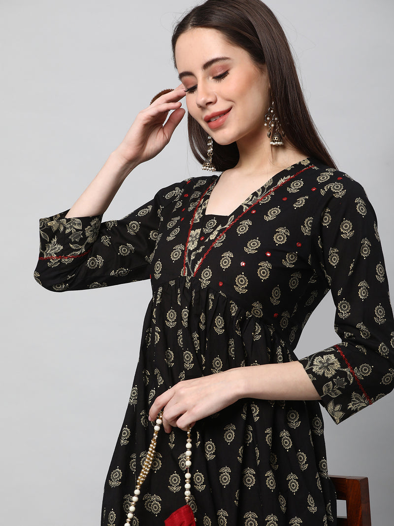 Printed cotton kurta with gathering and hand embroidery.