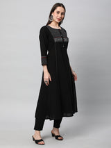 Leher - A line black kurta with textured fabric and block print detailing.