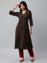 Printed cotton kurta with gathering and hand embroidery detailing.