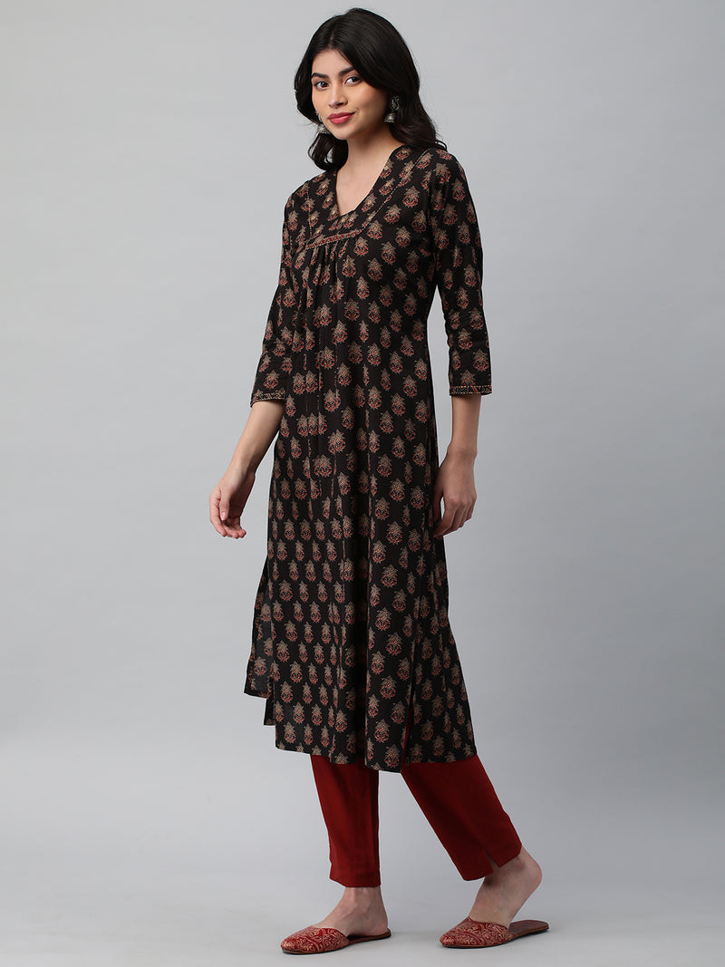 Printed cotton kurta with gathering and hand embroidery detailing.