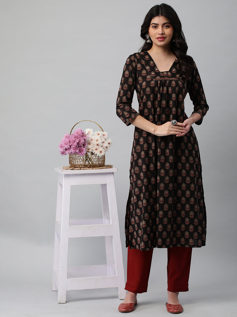 Printed cotton kurta with gathering and hand embroidery detailing.