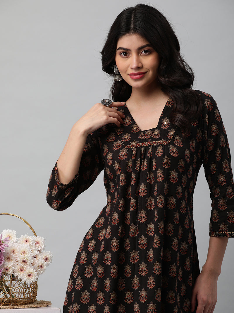 Printed cotton kurta with gathering and hand embroidery detailing.