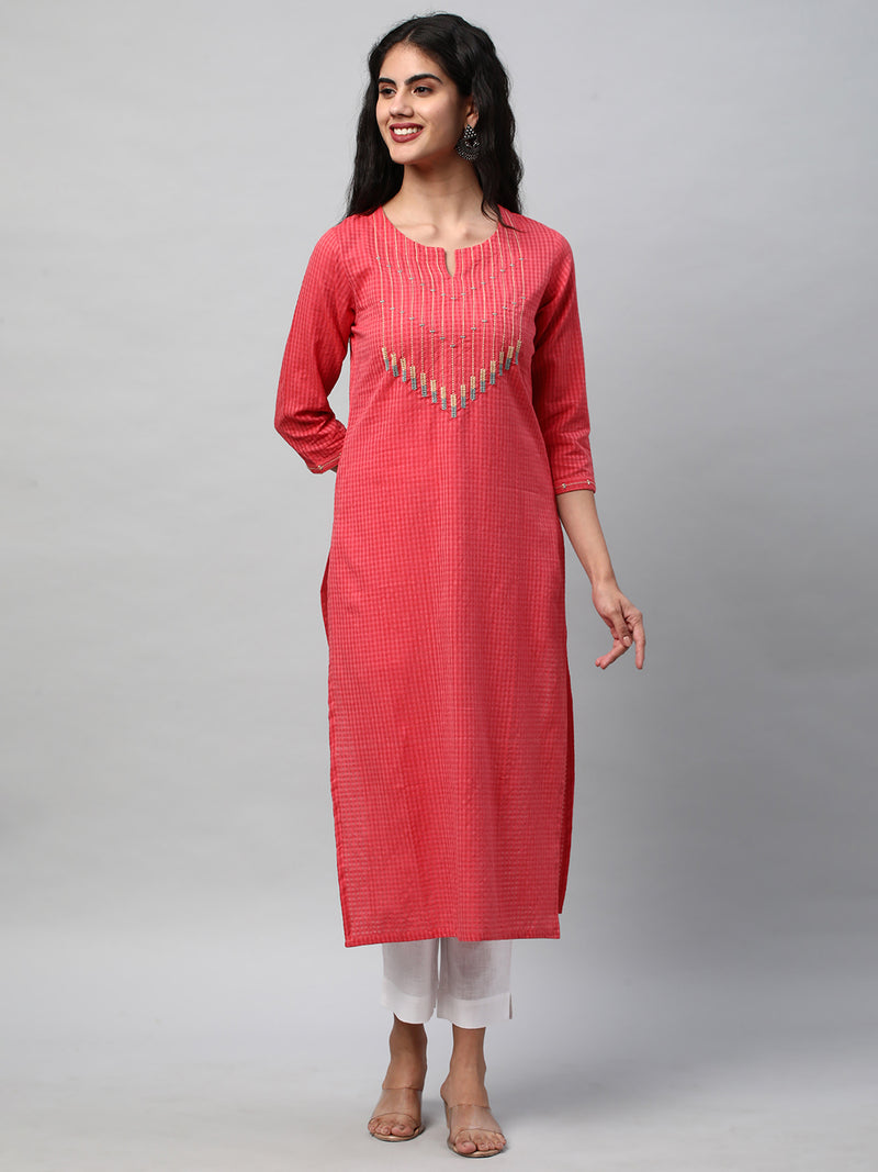 A straight kurta with machine embroidery at the center and sleeve