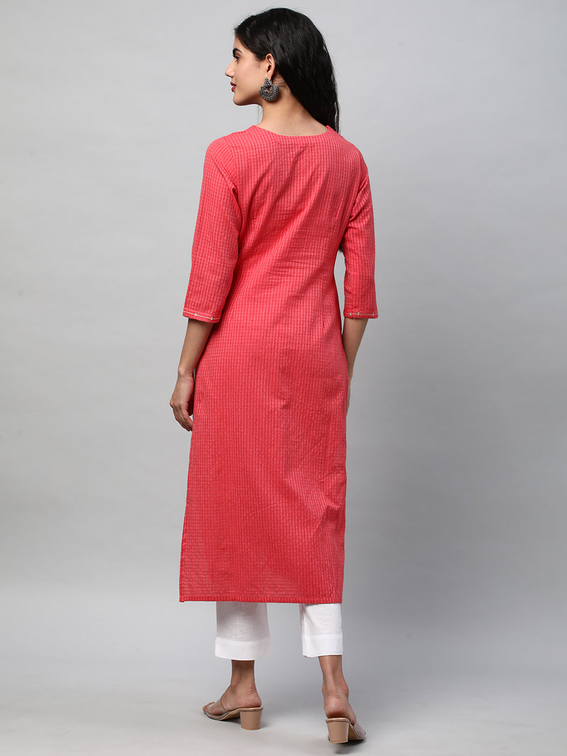 A straight kurta with machine embroidery at the center and sleeve