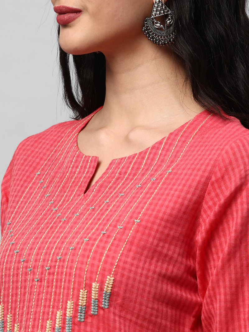 A straight kurta with machine embroidery at the center and sleeve