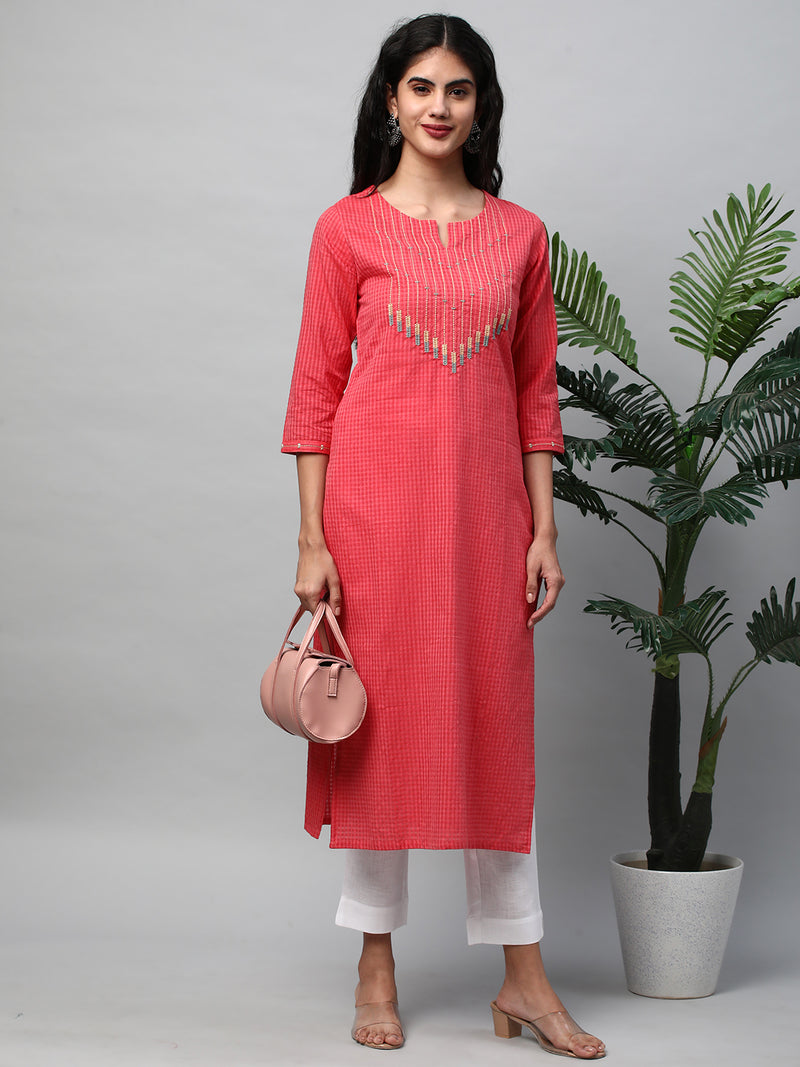 A straight kurta with machine embroidery at the center and sleeve