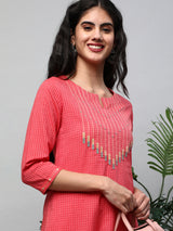 A straight kurta with machine embroidery at the center and sleeve