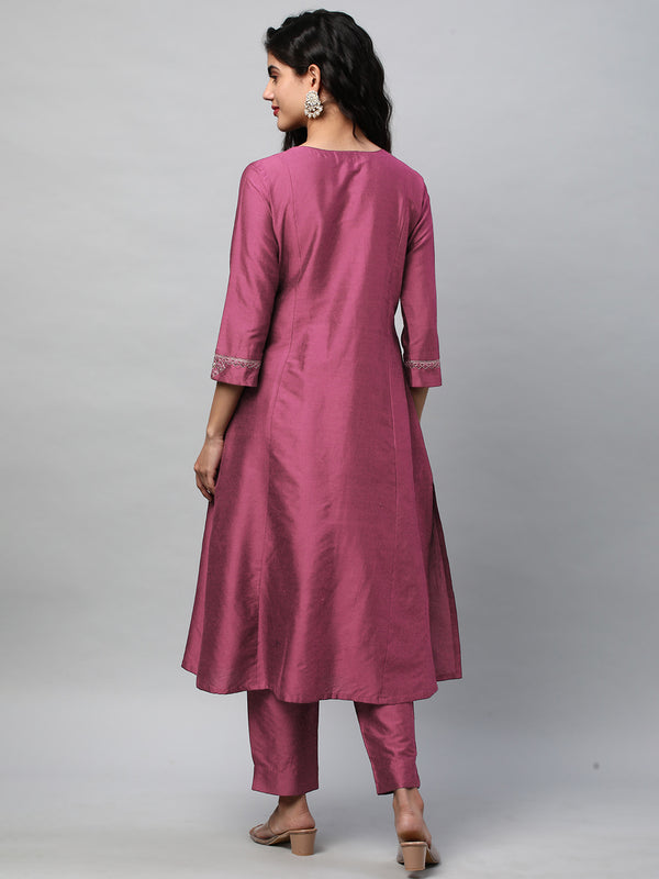 A flared kurta with machine embroidery placement of self light tone
