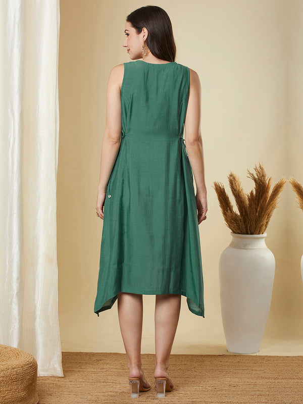 A-line high low sleeveless dress with embroidered yoke and tie-up waist.