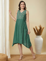 A-line high low sleeveless dress with embroidered yoke and tie-up waist.