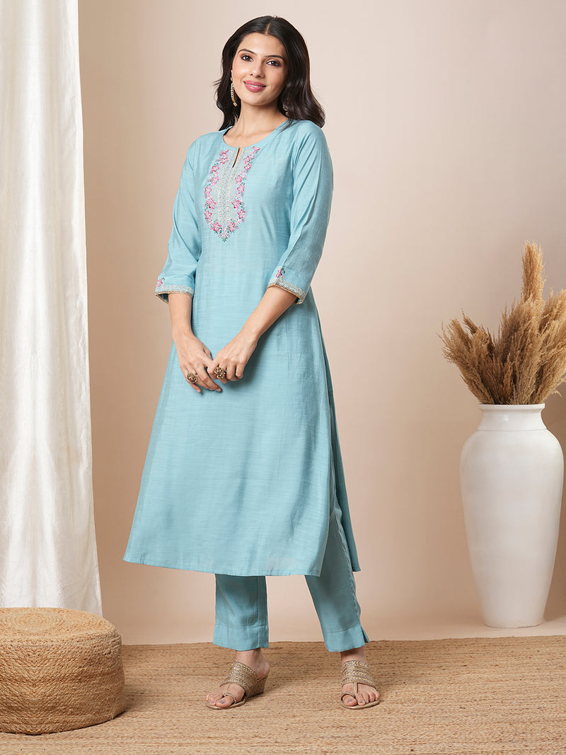 Embroidered straight fit silk blend kurta paired with lined pants and crushed dupatta.