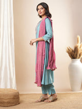 Embroidered straight fit silk blend kurta paired with lined pants and crushed dupatta.