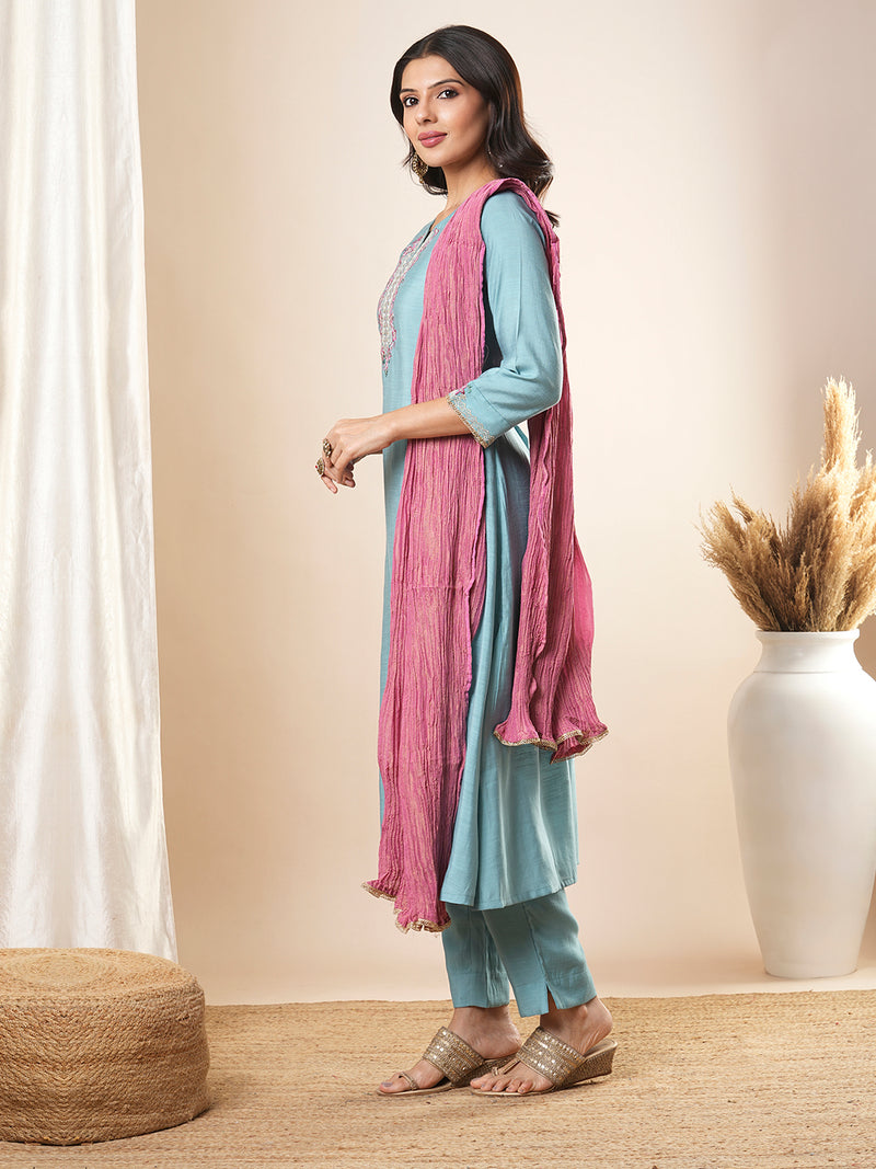 Embroidered straight fit silk blend kurta paired with lined pants and crushed dupatta.