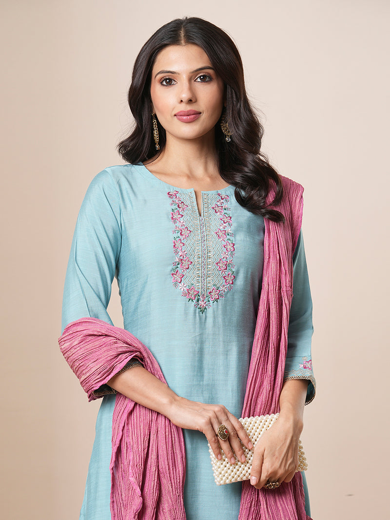 Embroidered straight fit silk blend kurta paired with lined pants and crushed dupatta.