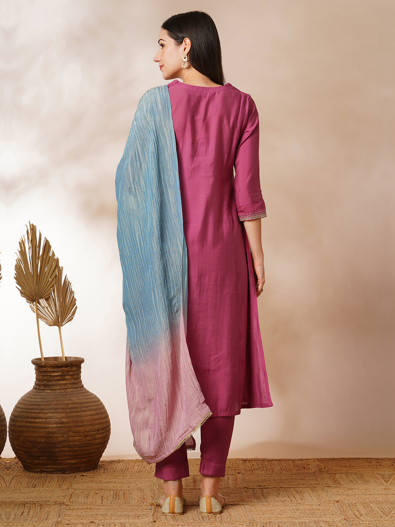 Tasya - A-line kurta in silk blend fabric with embroidery detailing paired with lined silk blend pants and shaded tissue dupatta.