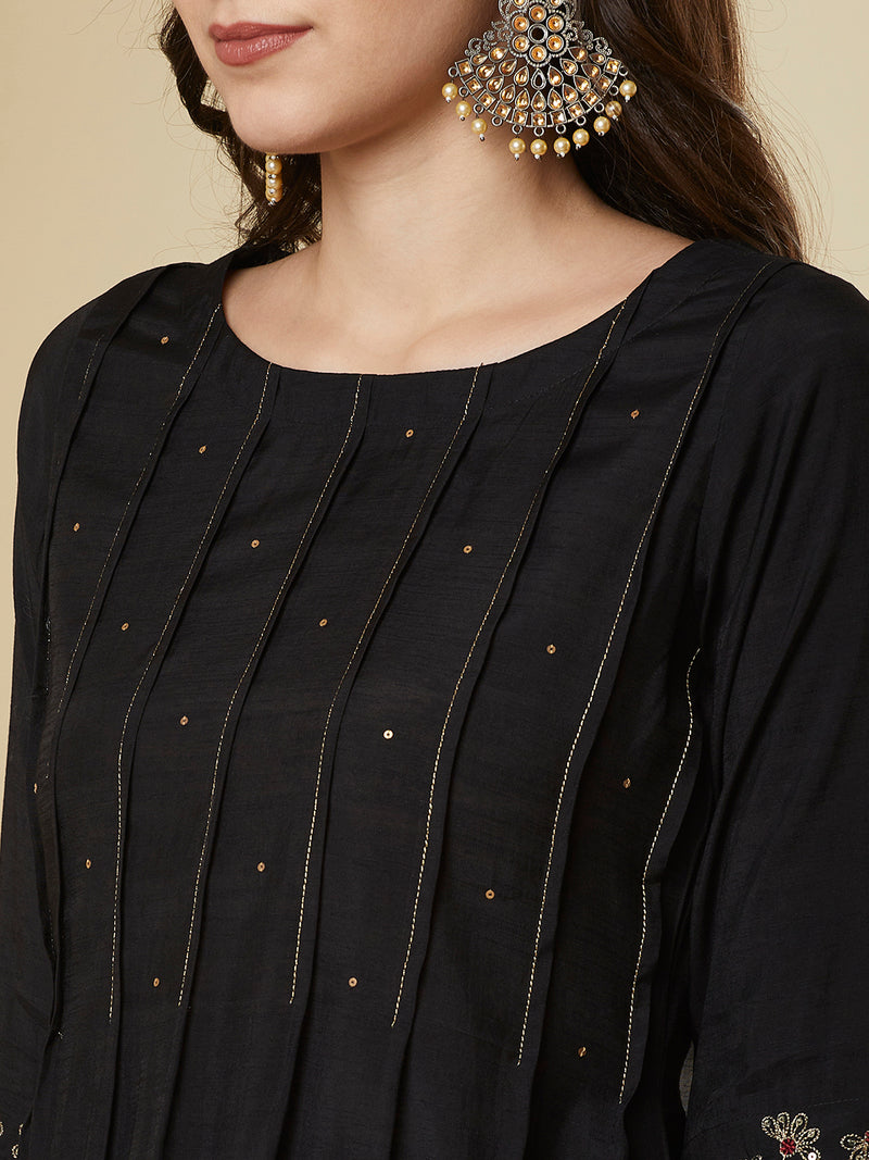 Pocketed A line kurta with zari pin tucks, sequin work and embellished sleeve.