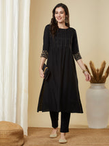 Pocketed A line kurta with zari pin tucks, sequin work and embellished sleeve.