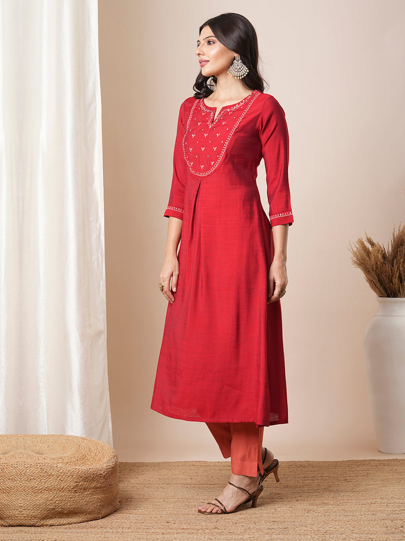 Flared avani silk kurta with a slit under the computer emboidred yoke.