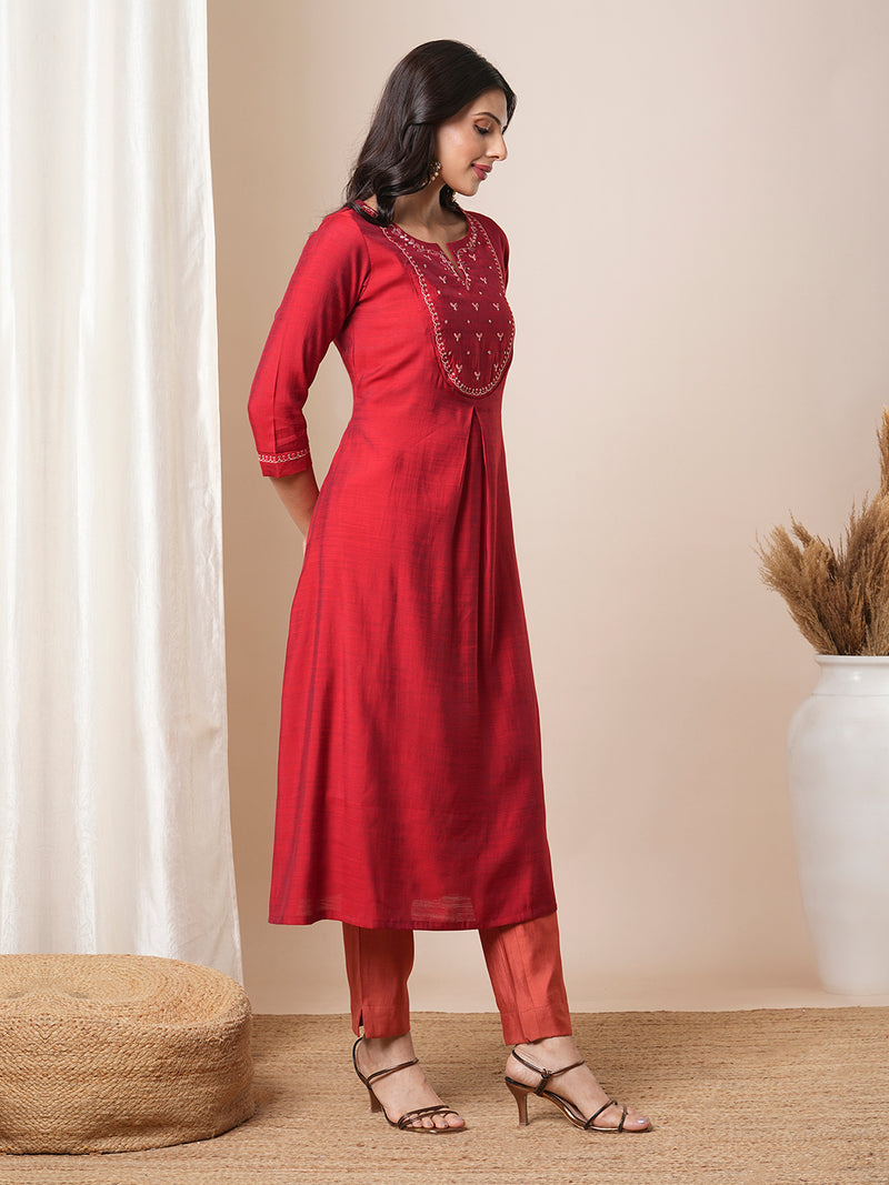 Flared avani silk kurta with a slit under the computer emboidred yoke.