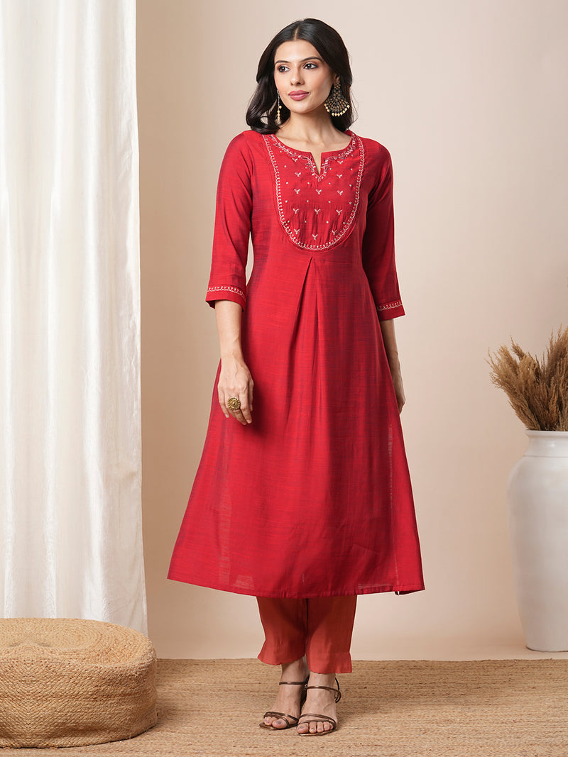 Flared avani silk kurta with a slit under the computer emboidred yoke.