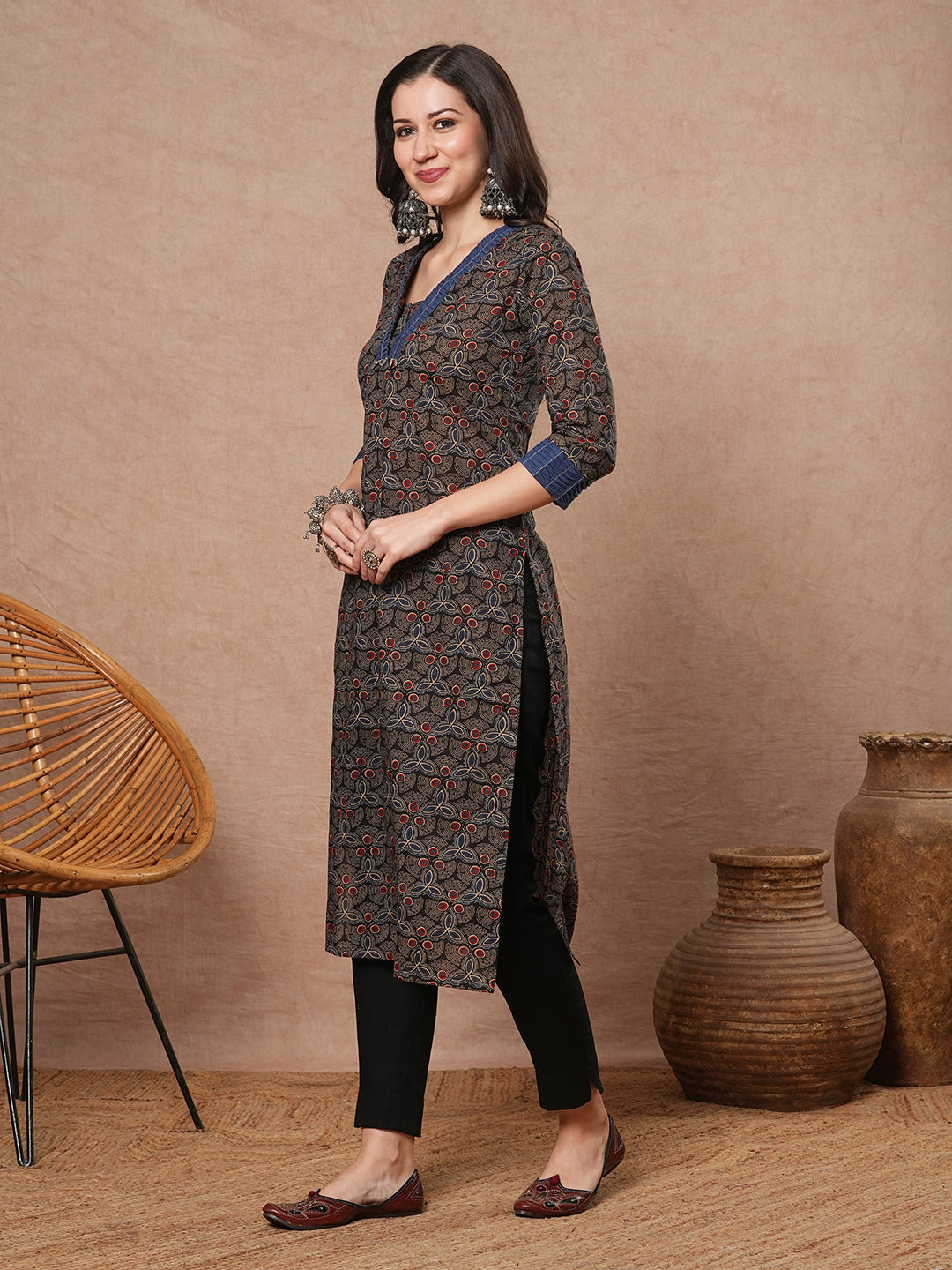 Straight fit printed kurta with contrast fabric smocking on neckline and cuff and silver trims