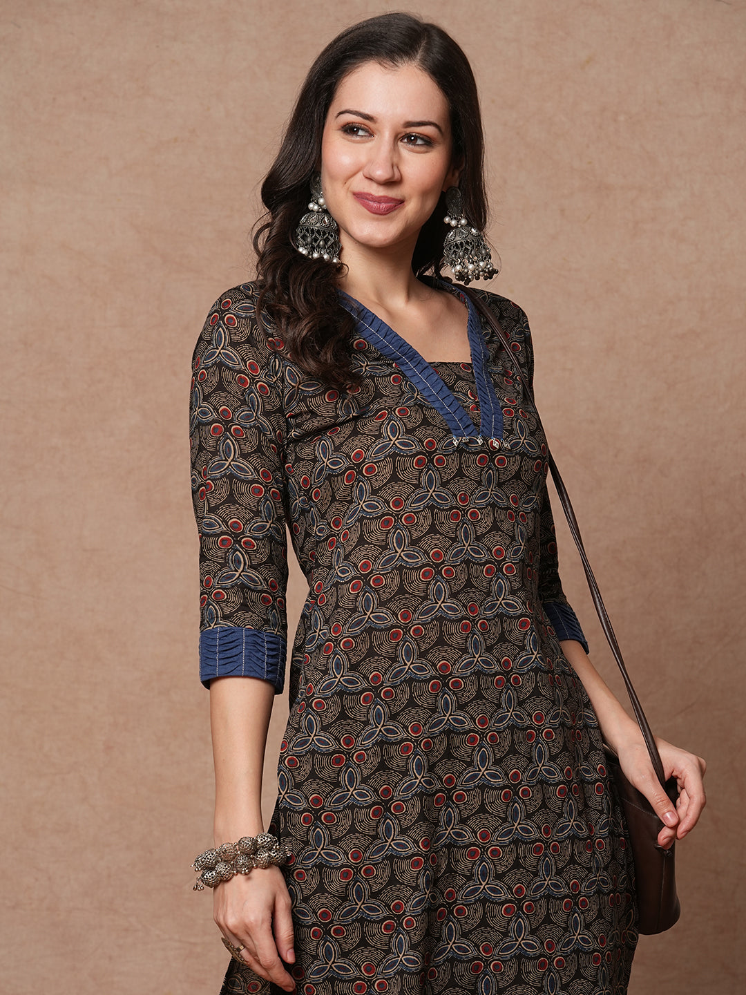 Straight fit printed kurta with contrast fabric smocking on neckline and cuff and silver trims