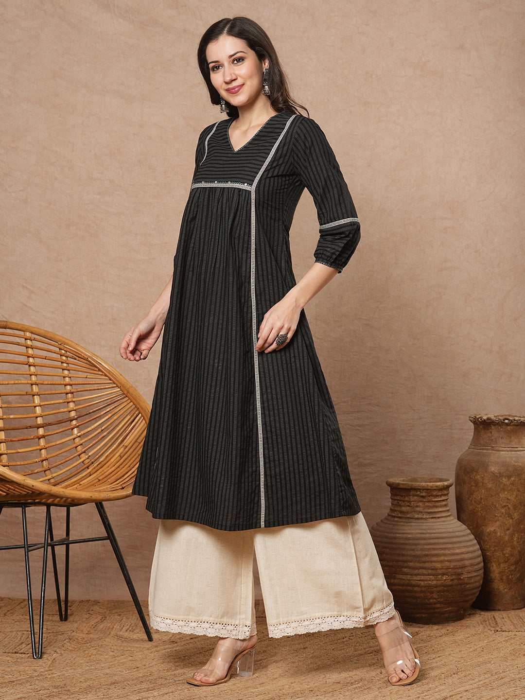 A-line shoulder princess kurta with under-bust gathers with contrast fabric trims and handwork