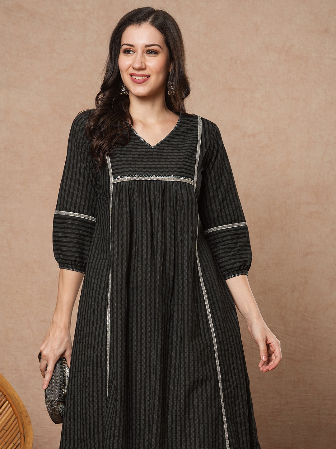 A-line shoulder princess kurta with under-bust gathers with contrast fabric trims and handwork