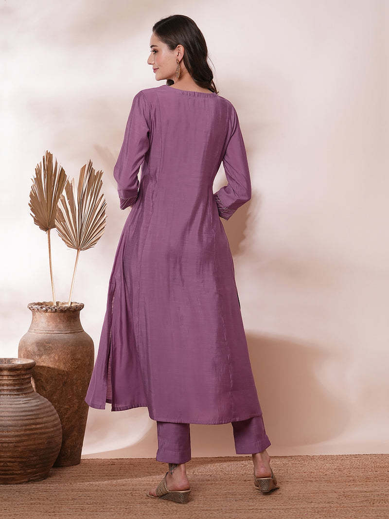 Inaara -Pocketed A line kurta adorned with zari embroidery and paired with lined silk blend pants.