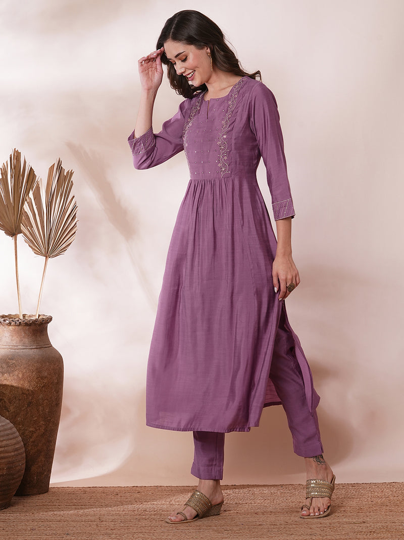 Inaara -Pocketed A line kurta adorned with zari embroidery and paired with lined silk blend pants.