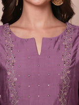 Inaara -Pocketed A line kurta adorned with zari embroidery and paired with lined silk blend pants.