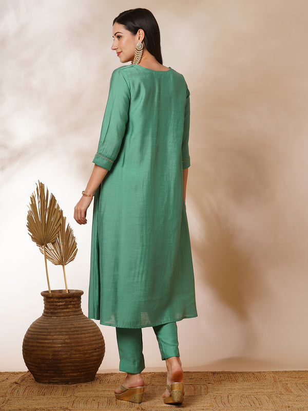 Inaara - Pleated A-line silk blend kurta with embroidery and pocket, paired with lined silk blend pants.