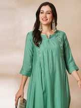 Inaara - Pleated A-line silk blend kurta with embroidery and pocket, paired with lined silk blend pants.