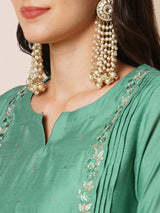 Inaara - Pleated A-line silk blend kurta with embroidery and pocket, paired with lined silk blend pants.