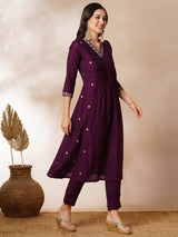 INAARA - A-line Pocketed silk blend kurta with zari embroidery and pleat detailing paired with lined pants.