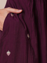 INAARA - A-line Pocketed silk blend kurta with zari embroidery and pleat detailing paired with lined pants.