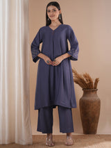 Panneled A line kurta with embroidery paired with lined palazzo in silk blend fabric