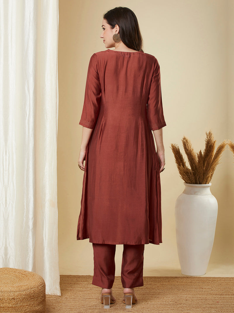 A-Line roman silk kurta set with zari embroidery with buttons on front yoke.