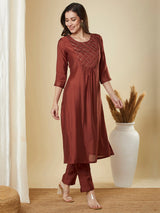 A-Line roman silk kurta set with zari embroidery with buttons on front yoke.