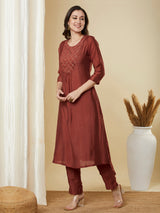 A-Line roman silk kurta set with zari embroidery with buttons on front yoke.