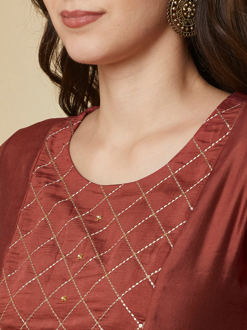 A-Line roman silk kurta set with zari embroidery with buttons on front yoke.