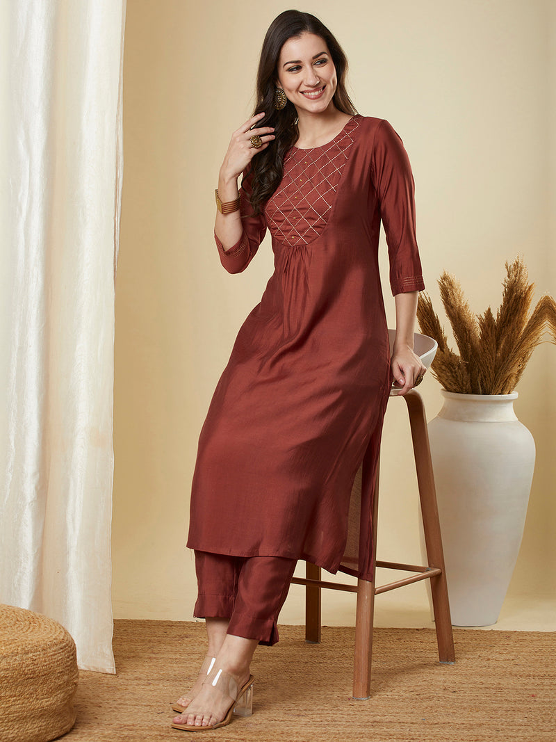 A-Line roman silk kurta set with zari embroidery with buttons on front yoke.