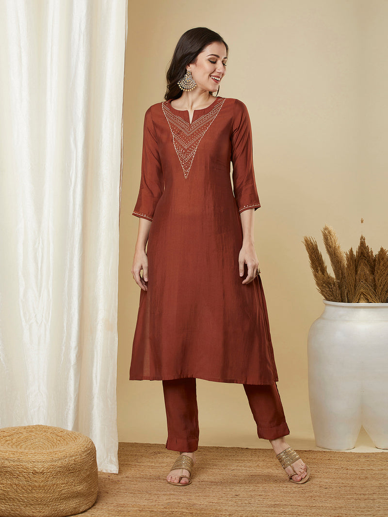 Roman silk kurta set with a triangle yoke adorned with sequins and zari work
