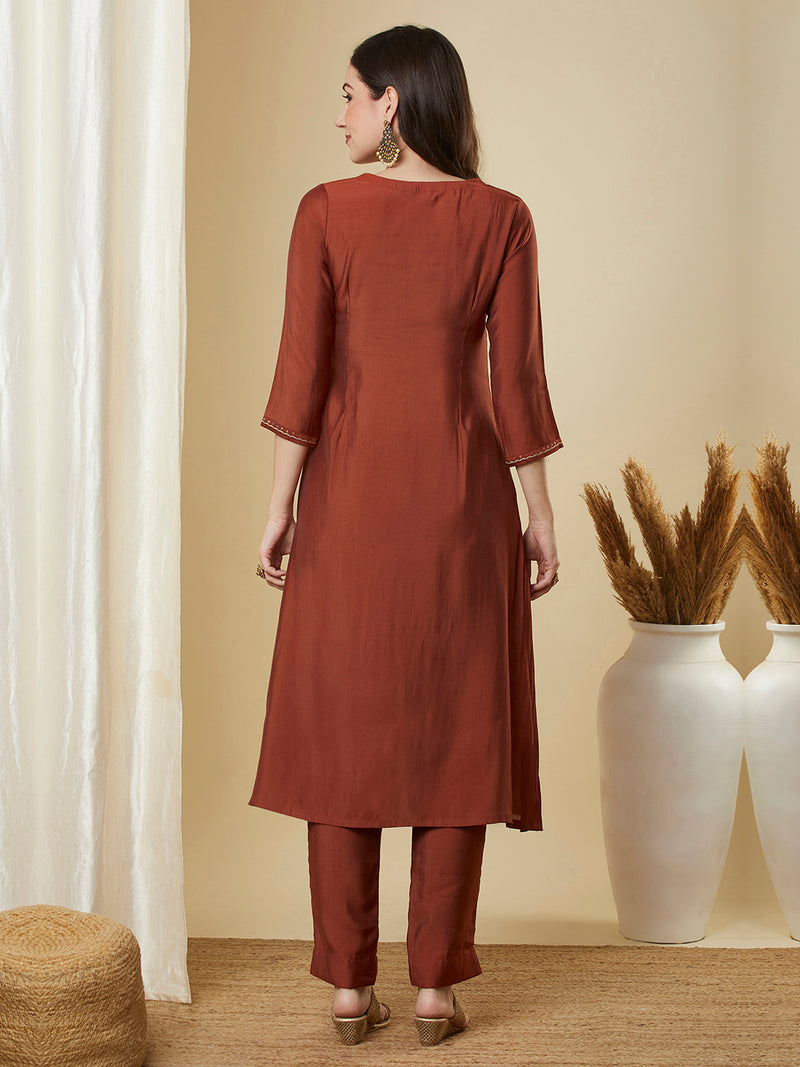 Roman silk kurta set with a triangle yoke adorned with sequins and zari work