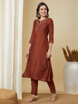 Roman silk kurta set with a triangle yoke adorned with sequins and zari work