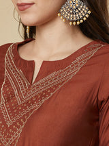 Roman silk kurta set with a triangle yoke adorned with sequins and zari work